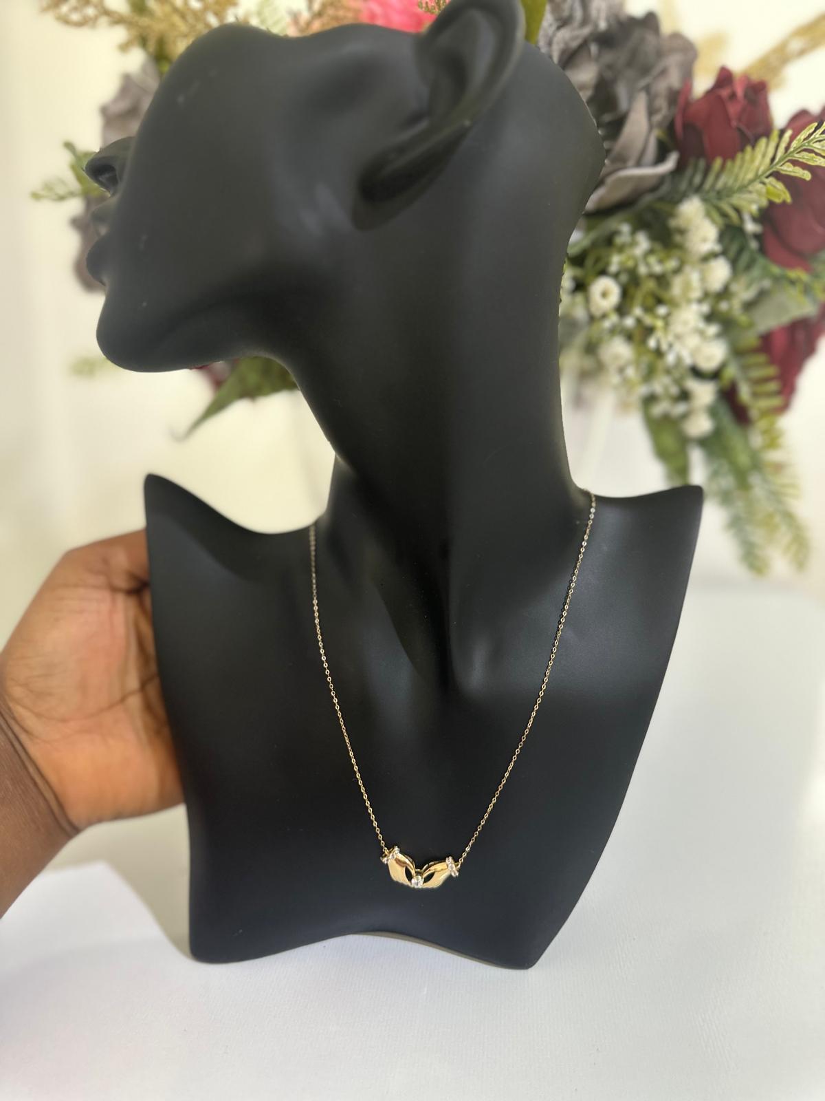 18k gold necklace with hands & heart pendant